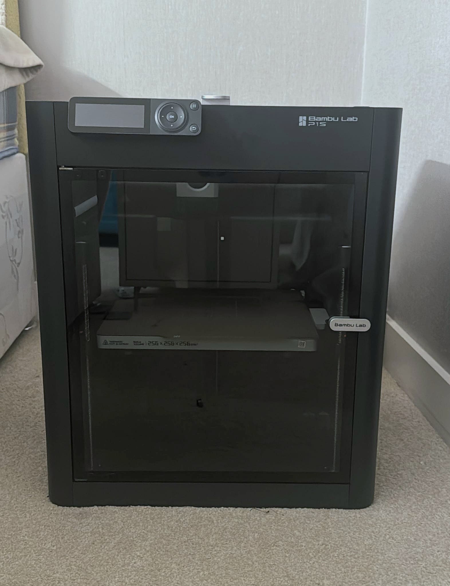 A Bambu Lab P1S enclosed 3D printer in the ClearZone workshop, used to print production-grade cases